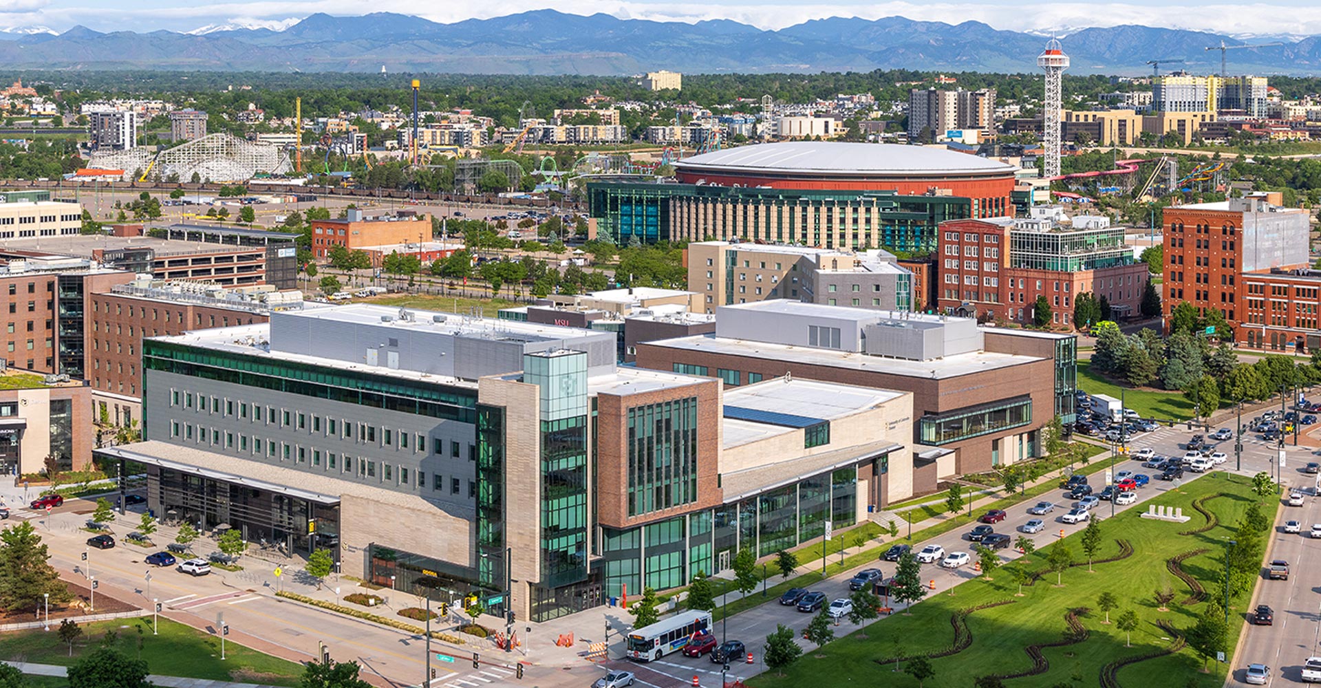 Aerial shot of CU Denver student center with Rocky Mountains in the background
