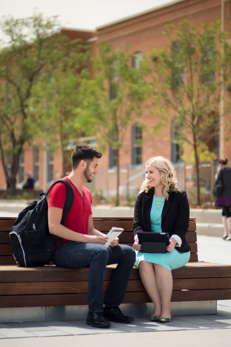 Two students sitting on campus