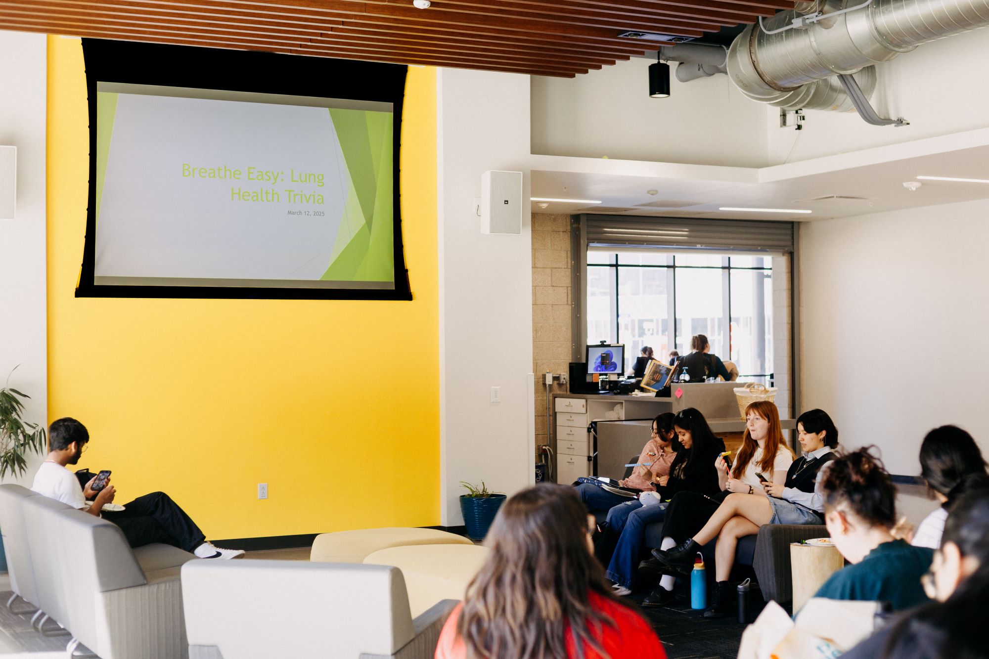 group of people sitting on couches