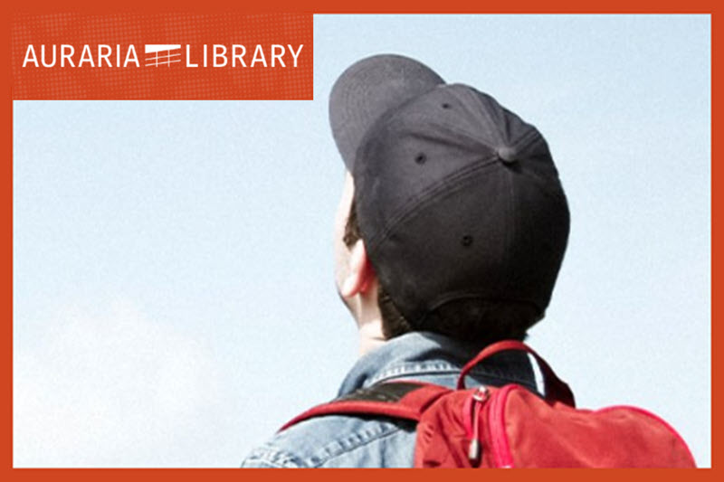 Student with backpack looking up at the sky