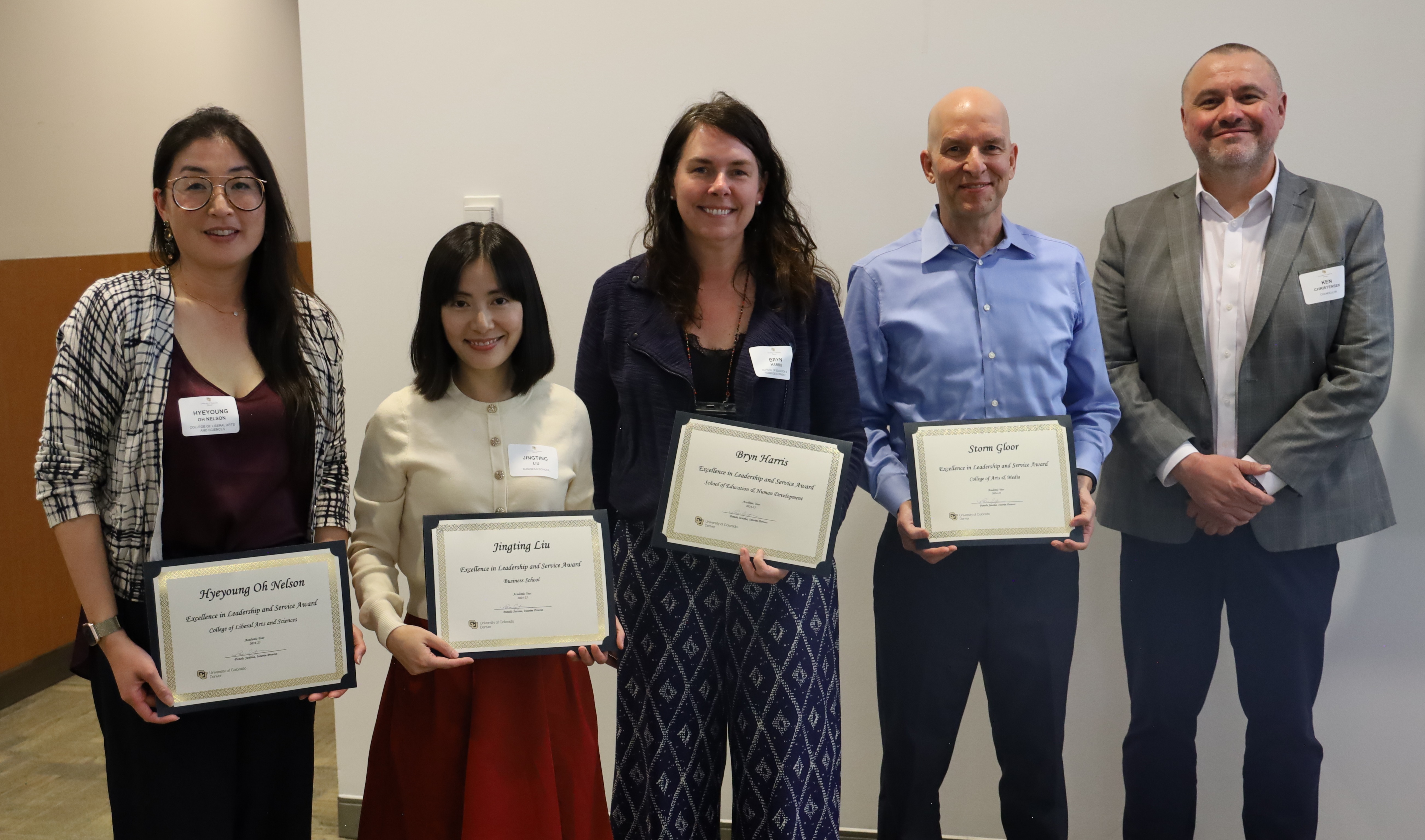 Tenured/Tenure-Track Leadership and Service winners Hyeyoung Oh Nelson, Jingting Liu, Bryn Harris, and campus winner Storm Gloor with Chancellor Christensen