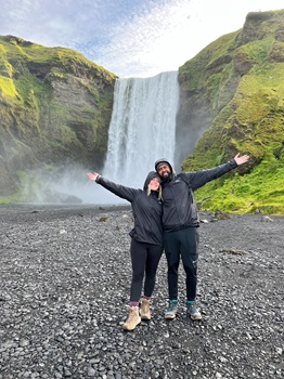 Emily Wheeler looking over railing at view of hotspring