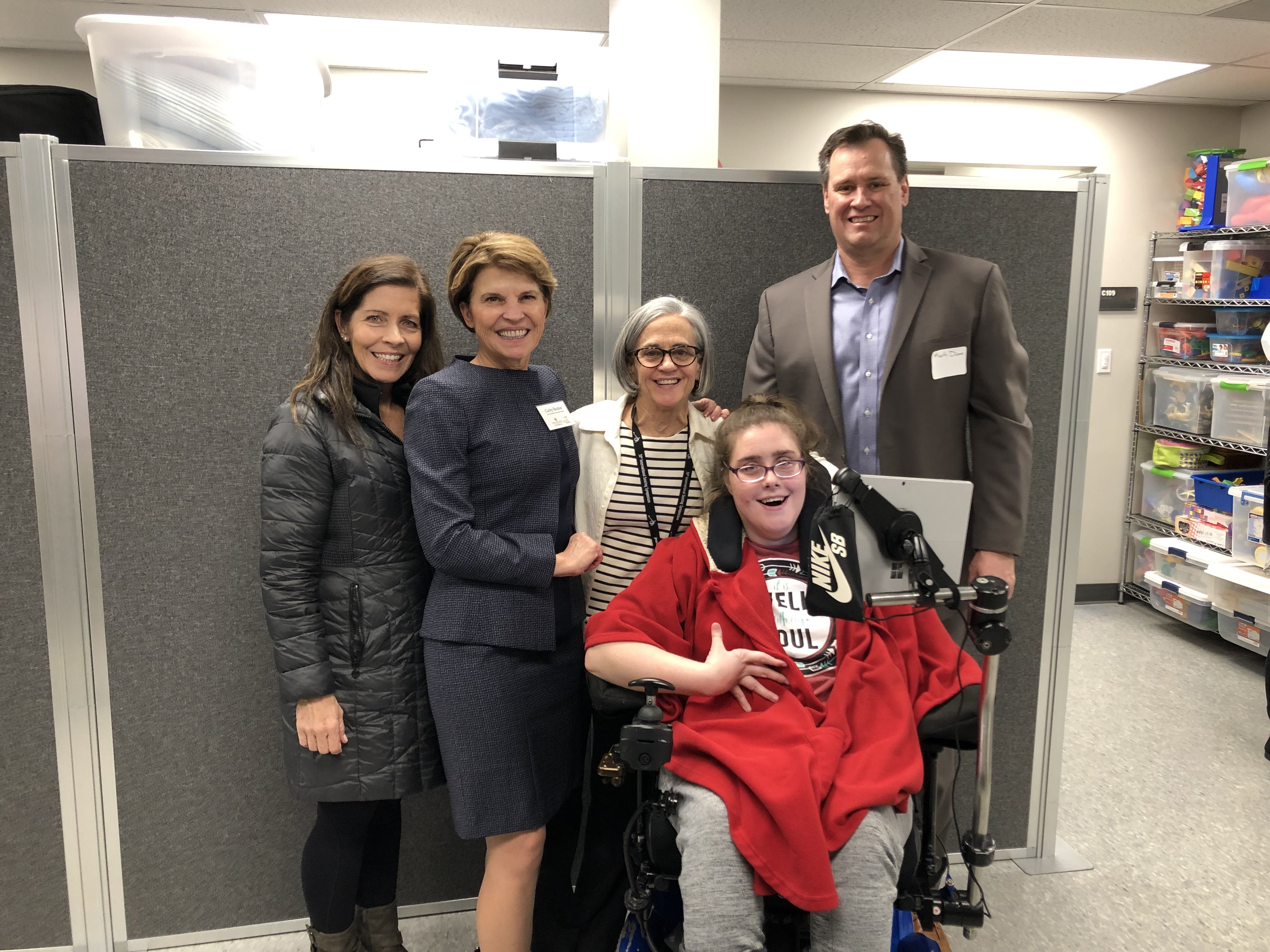 CIDE staff and friends pose for a photo during an open house