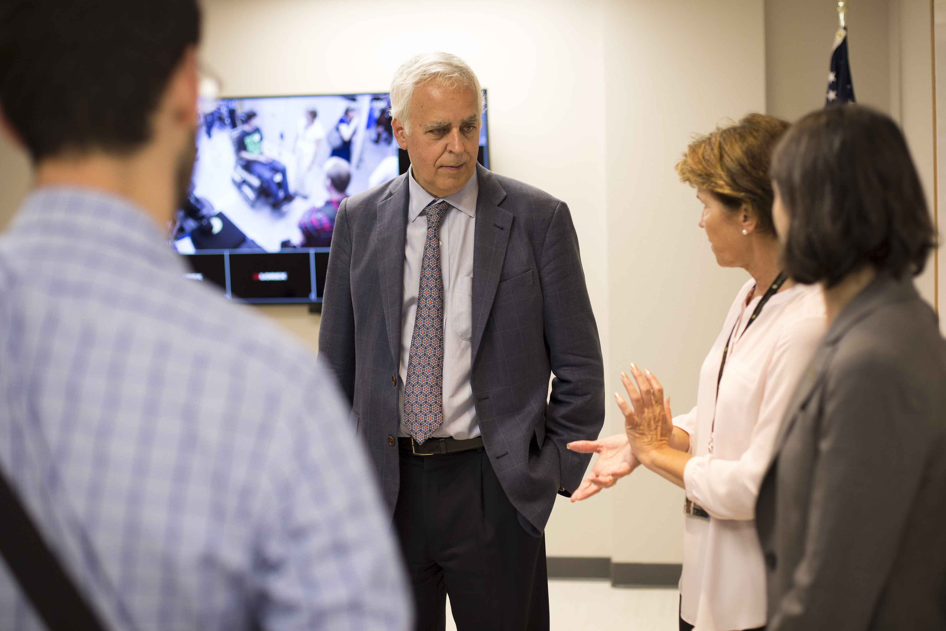 C I D E directors chats with guests during a open house