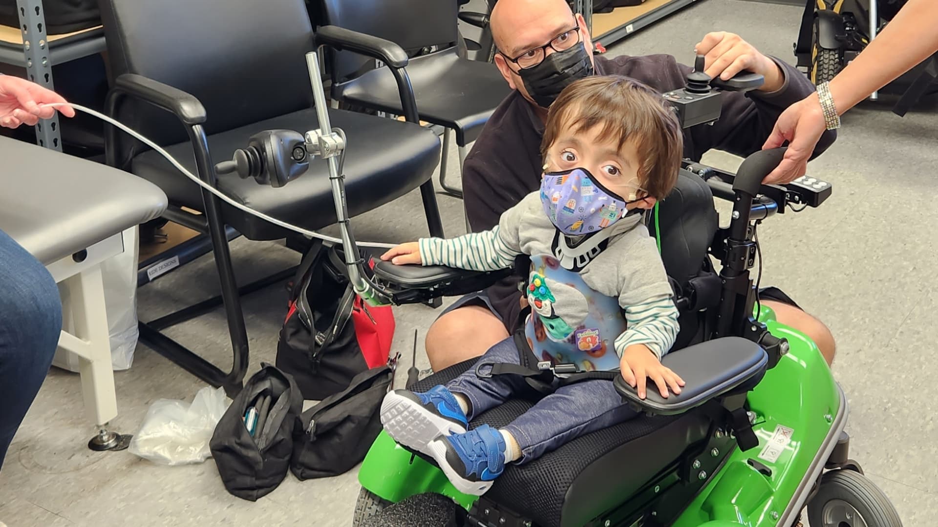 A young boy in a wheelchair at the Assistive Technology clinic