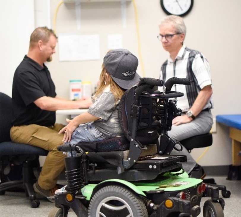 A CIDE clinician works closely with a client and a wheelchair supplier to design a chair that fits the person's needs and preferences.